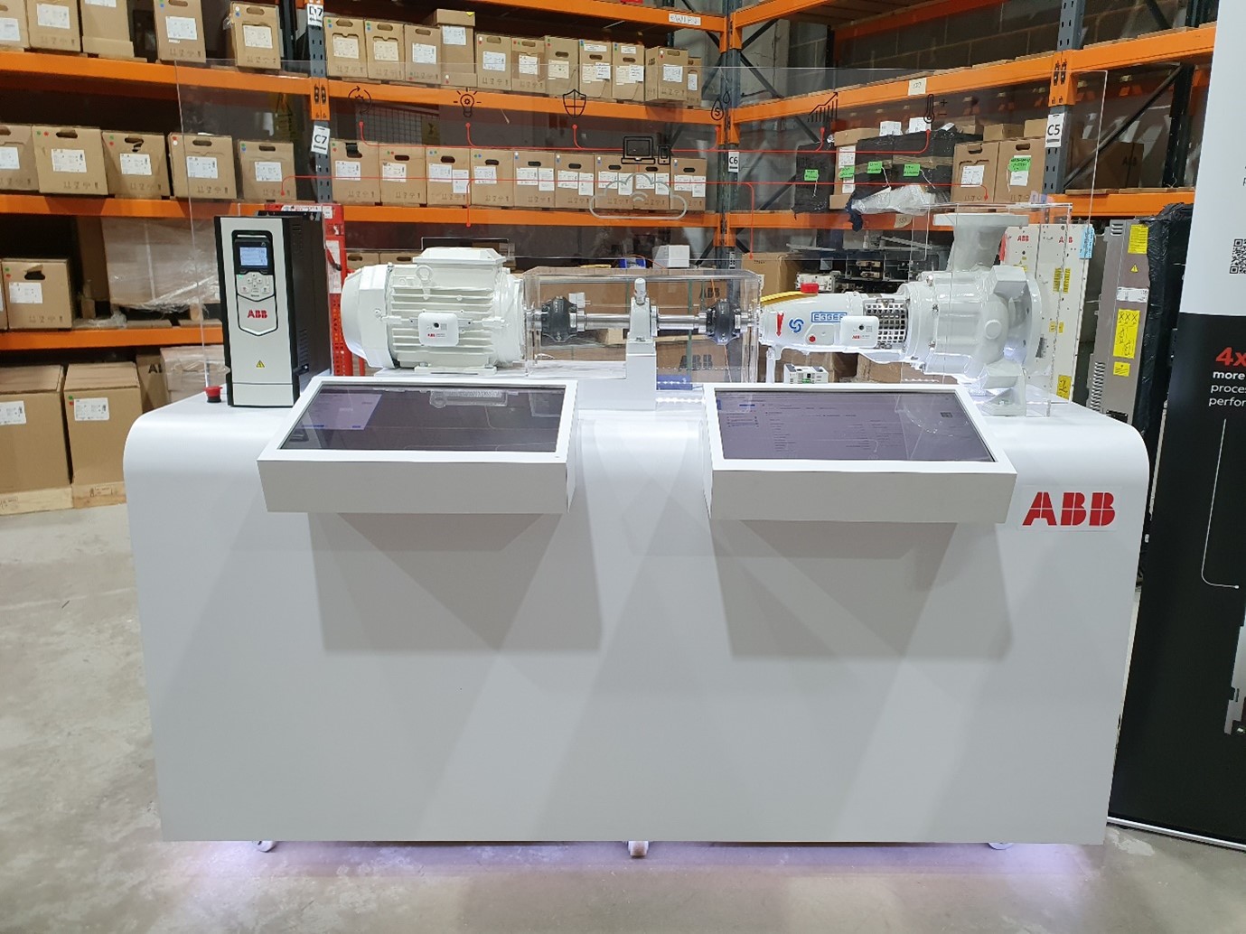 This picture shows an ABB stand with a Motor, SYNRM motor Variable speed drive, and an ABB Samrt Sensor as well as data screens