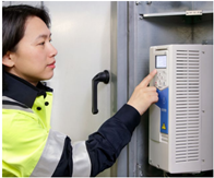 variable speed drive training - this image shows a person using an ABB variable speed drive keypad